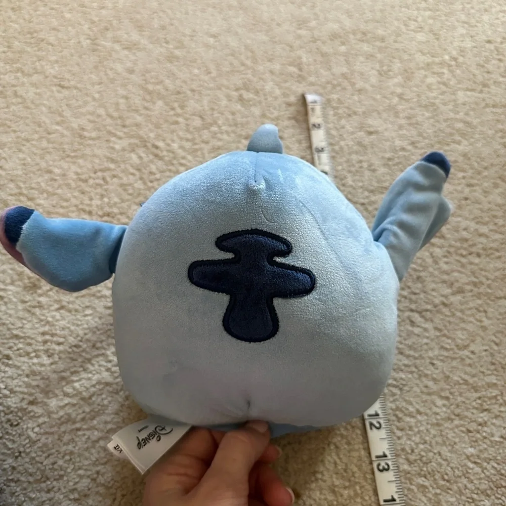 Disney Stitch holding Scrump